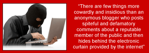 Masked man at computer